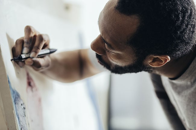 Artistic man paints