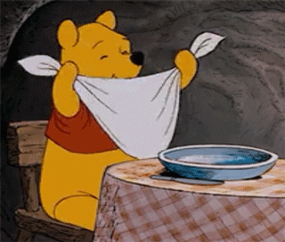 Animated GIF of Winnie the Pooh getting ready to eat lunch