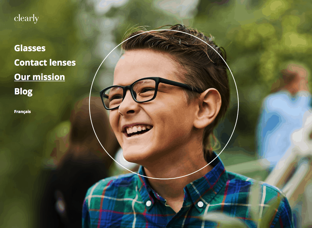 Clearly splash page example. The page only includes a condensed version of the site navigation with four items and an image of a child wearing glasses. 